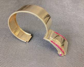 1950â€™s Gutenstein Brothers 14k Buckle Bangle With Over 3 Ctw Of Rubies 42.2g This 1950â€™s Designer Buckle Bangle Features 26, 12pt Princess Cut Rubies And 2, 15pt Cabochon Rubies, One On Each Side. This Bracelet Was Also Designed To Function As A Dress Clip. This Piece Is Guaranteed To Turn Heads At Every Occasion. Carat Weights Are Appropriate.