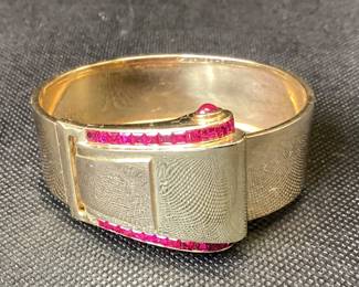 1950â€™s Gutenstein Brothers 14k Buckle Bangle With Over 3 Ctw Of Rubies 42.2g This 1950â€™s Designer Buckle Bangle Features 26, 12pt Princess Cut Rubies And 2, 15pt Cabochon Rubies, One On Each Side. This Bracelet Was Also Designed To Function As A Dress Clip. This Piece Is Guaranteed To Turn Heads At Every Occasion. Carat Weights Are Appropriate.