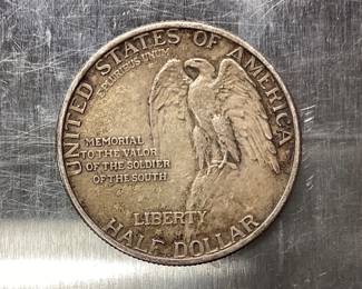 1925 STONE MOUNTAIN HALF DOLLAR DESIGNED BY GUTZON BORGLUM. THE 1925 STONE MT. HALF DOLLAR WAS STRUCK TO RAISE FUNDS FOR THE COMPLETION OF THE MONUMENT IN STONE MOUNTAIN, GEORGIA