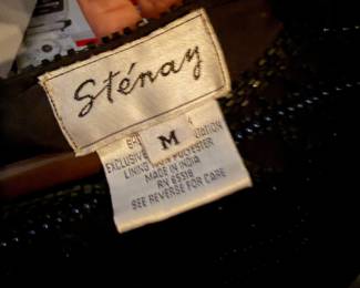 Sténay garment renowned for their intricate, hand-embellished formalwear from the 1980s and 1990s, this piece features a dense application of shimmering black beads and sequins. |  $70