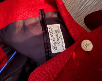 Marshall Field & Company "Better Sportswear" red jacket, | vibrant red tailored piece featuring a textured "nubbly" or woven wool-like fabric with a classic single-button closure |  $150