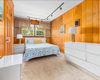 White laminate queen bedroom suite; table lamps