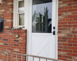 Entry door; storm door; exterior light