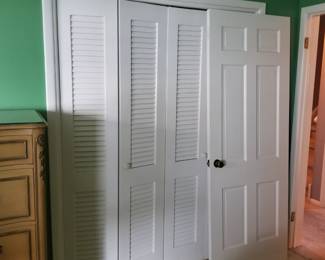 Solid wood 6-panel interiors doors; louvered bifold doors