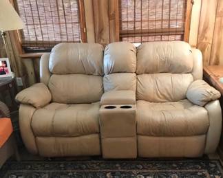 Vinyl rocker recliner love seat- this is only item inside home for sale. Must ask to view