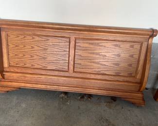 Queen sleigh bed with headboard and footboard and one stand. 
