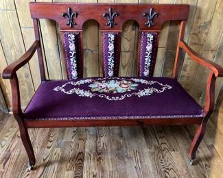 Antique loveseat with needlepoint seat