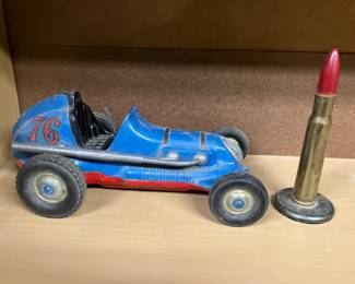 Toy racecar, bullet paperweight