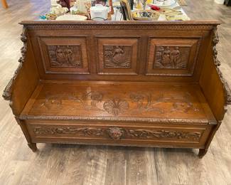 Incredible antique heavy oak English bench with storage. Exquisitely  carved lions heads, acorns, maiden and country couple & scroll work. 55 L  x 19 W  x 36 H