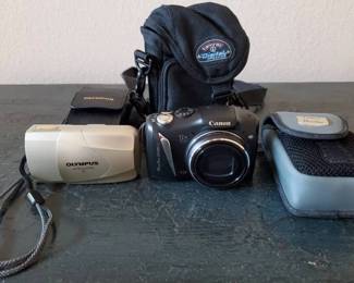 MO259Canon And Olympus Digital Cameras 