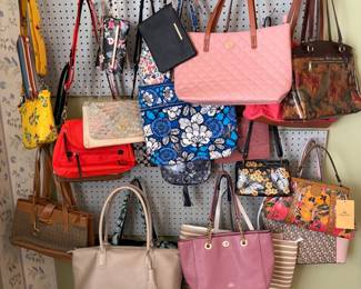 Ladies handbags including designer name brands like Coach, Patricia Nash and Anuschka.  