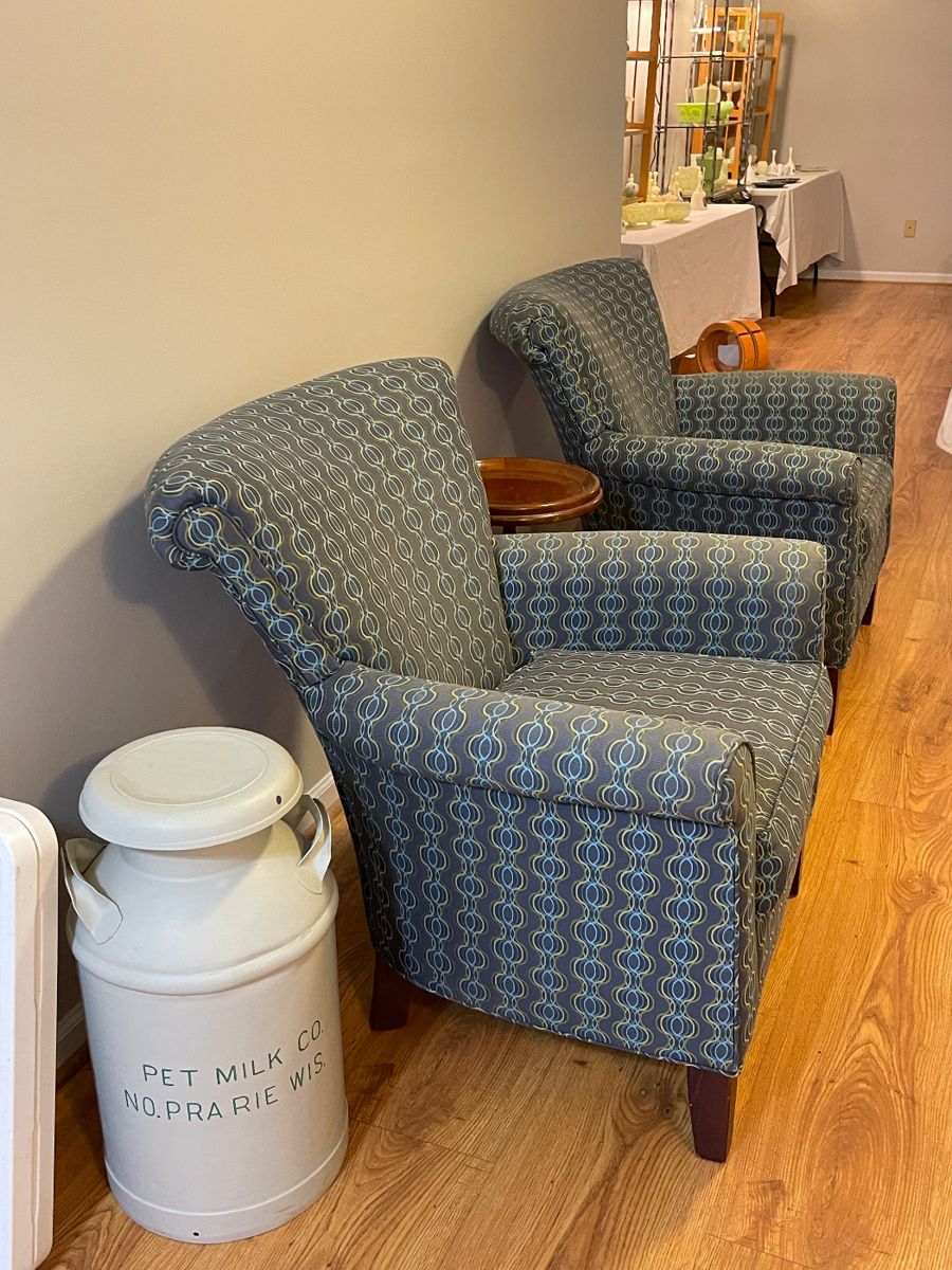 Pet Milk can and a pair of upholstered chairs