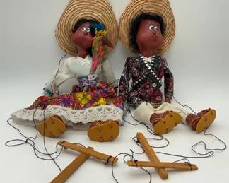 Vintage Mexican folk art string puppets of a man and woman