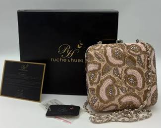 Contemporary ruche hues Pink Bliss Minaudire beaded clutch with a silver chain strap