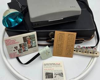 Vintage gray Polaroid 230 Automatic Land Camera. 