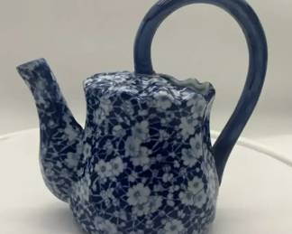 Vintage Victoria Ware Ironstone pitcher with a blue and white calico floral pattern.
