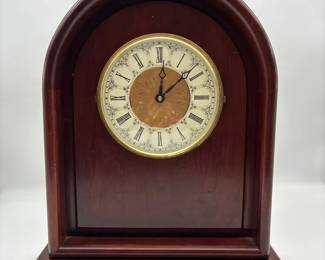 solid mahogany Gothicstyle mantel clock by The Bombay Company.