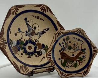 Tonala Mexican folk art pottery plates featuring a handpainted bird and floral design