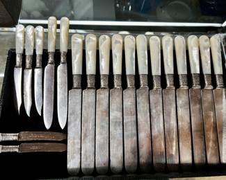 Lot # 76: Collection of Antique Mother of Pearl and Sterling Banded Formal Dinner Knives