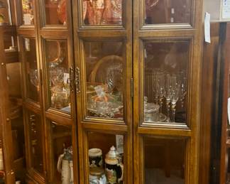Lot #52: Tall and Narrow Vintage Thomasville Lit Display Cabinet with Bi-Fold Doors