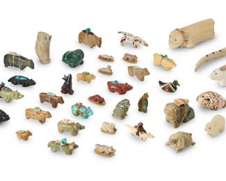 273
A large group of Southwest Pueblo carved stone fetish animals
Mid/late 20th century
Unmarked
Comprising multiple figures including bears, squirrels, lizards, turtles, frogs, badgers, foxes, ducks, an eagle, a carved antler owl, a carved antler 'Kolowisi' water serpent style figure, and a carved wood heartline wolf, most others in carved stones including pipestone, onyx, and turquoise, and shell, eighteen figures with medicine bundles
36 pieces
Largest: 01.625" H" x 2.25" W x 5.5" D; Smallest: 0.625" H x 0.5" W x 1" D
Estimate: $200 - $400