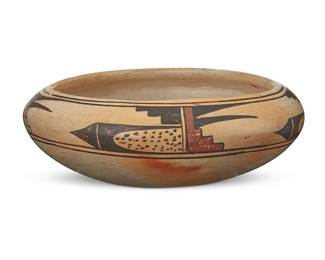 99
A Hopi Pueblo polychrome pottery bowl
Early 20th century
With applied paper label: From The Hopi Villages
The three-color low bowl with red and brown geometric banding to shoulder on a cream slip ground
2.875" H x 7.5" Dia.
Estimate: $500 - $700