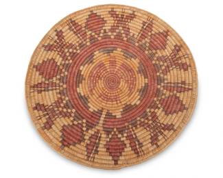 66
A monumental polychrome pictorial Navajo wedding basket
Late 20th century, Diné, attributed to Nora Endichy
An extra-large coiled tray with a central eagle and banded star motif and with butterfly motifs to edges
2.75" H x 30" Dia.
Estimate: $200 - $400