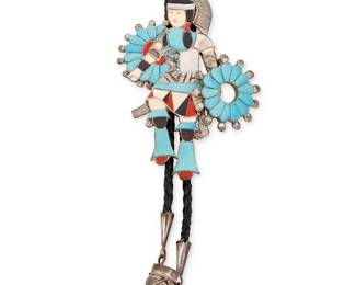 179
An Eddy Beyuka Zuni sterling silver bolo tie with turquoise and shell inlay
Edward A. Beyuka (1921-2002, Zuni Pueblo)
Mid/late 20th century
Stamped: EAB / Zuni
A large Zuni dancer bolo tie with carved turquoise, coral, mother of pearl, and bone inlay, with a removable round brooch to one hand, all on a braided leather cord with silver cone tips- and drum motif dangles
Bolo: 44.75" H x 2.25" W; brooch: 1.625" Dia.; cord: 38" L
84.3 grams gross
Estimate: $500 - $700