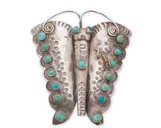 187
A Southwest style sterling silver and turquoise butterfly pendant/brooch
Mid-20th century
Unmarked
A large pendant/brooch with small turquoise cabochons, stamped accents, and silver wire features
3" H x 2.625" W
32.9 grams gross
Estimate: $200 - $400