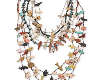 125
A group of Southwest Pueblo style carved fetish necklaces
Late 20th century
Unmarked
Comprising a three strand necklace of heishi and carved shell and stone animal fetish figures (28" L), two single strand necklaces, one with carved shell ducks (17" L), and one with carved stone turtles and blue beads (20" L), together with three choker necklaces of liquid silver beads and carved shell birds and fish (21" L; 17" L; 16" L), and a silver bead choker necklace with diminutive silver birds (15.75" L)
7 pieces
151.0 grams gross
Estimate: $200 - $400