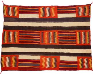 26
A Navajo Second Phase wearing blanket
Late 19th/early 20th century, Diné
Woven in orange, red, brown, cream, yellow, and black wool with striped banding alternating with multicolored sawtooth and striped panels
54" H x 73" W
Estimate: $2,000 - $4,000