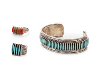 185
A group of Janice Paloma Zuni sterling silver and needlepoint jewelry
Janice Paloma (b. 20th century, Zuni Pueblo)
Late 20th century
A sterling silver and turquoise cuff bracelet with a matching ring, as well a similar style ring in coral
Each variously stamped: Paloma / Zuni
The cuff and each ring with a band of fine row-set needlepoint turquoise or coral and stamped motifs to edges
3 pieces
Cuff: 6.5" total inner C x 0.75" H, with a 1.375" gap; Ring sizes: 7 & 6.5
46.6 grams gross
Estimate: $300 - $500