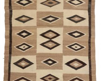 12
A Navajo regional rug
Early 20th century, Diné
Woven in cream, natural grey, black, and dark brown wool, with floating diamonds and a dark brown spirit line
80.5" H x 49" W
Estimate: $800 - $1,200