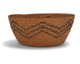 153
A large Apache basket
Early/mid-20th century
A coiled tapered tall tray with a rod foundation, cross-stitched rim, and three bands of stepped zigzags
5" H x 12" Dia.
Estimate: $200 - $400