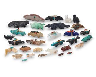 240
A group of Southwest Pueblo carved stone animal fetish figures
Mid/late 20th century, mostly Zuni Pueblo
Seven labeled for artist
A large group of carved stone animals, including big cats, foxes, wolves, and a large lizard, in various stones including turquoise, shell, pipestone, lapis lazuli, onyx, and jet, and in various sizes, comprising seven figures by Zuni artists including Nelson Yatsattie, Jessie LeBeouf, Pat Homer, Melissa Quam, Banteah (label),and Sheche (label), as well as twenty-three further animals, most with mounted offerings
31 pieces
Largest: 1.25" H x 4" W x 0.5" D; Smallest: 0.25" H x 0.75" W x 0.125" D
Estimate: $200 - $400