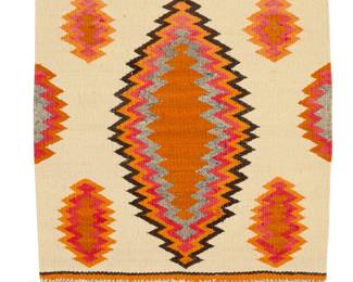 4
A Navajo Transitional textile
Late 19th/early 20th century, Diné
Woven in cream, orange, red, brown, and grey wool with a radiating central diamond and alpaca/goat fringe
20" H x 20" W; Fringe: 3"
Estimate: $500 - $700