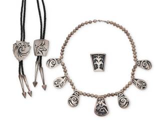 256
A group of Hopi Pueblo sterling silver overlay jewelry
Mid/late 20th century
Four works:

Larry Pooyouma (d. 1991; Hopi Second Mesa)
A Hopi silver overlay tab necklace
Stamped verso with artist's corn cypher and Hopi Silvercraft Guild hallmark
With seven tabs featuring various geometric Pueblo motifs, all suspended on a single strand of silver beads
22.5" L x 1.75" H

A group of Hopi silver overlay bolos
Each marked for Hopicrafts shop; two marked with artist's cipher JH [conjoined; likely James Honyaktewa, Hopi]; one with 'pipe' picto mark for Roy Tawahongva
Comprising three silver overlay bolos including a Roy Tawahongva Hopi overlay bolo with an antelope motif, as well as a JH parrot motif bolo, and a JH cornstalk/Tree of Life motif bolo, two mounted to a braided leather cord and with silver tips
3 pieces
Bolo slides: 2" H; 1.75" H; 1.625" H; cords: 39" L

4 pieces total
188.1 grams gross
Estimate: $500 - $700