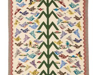 32
A Navajo pictorial Tree of Life textile
Late 20th century, Diné, Jean Monroe
Woven in multicolored wool including cream, grey, and pink, with ninty-six birds and flowers on either side of a large corn stalk Tree of Life, with a wedding basket and cornsilk
61.5" H x 37" W
Estimate: $800 - $1,200