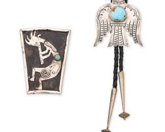260
Two Southwest style sterling silver bolo ties
Mid/late 20th century
One stamped: JVT / Sterling; one stamped: Ligon / Sterling
Comprising a sterling silver eagle bolo brooch with central set turquoise and stamp work accents, on a braided leather cord with silver tips, together with a large shield-shaped silver overlay bolo with Kokopelli motif and set turquoise cabochon accent
2 pieces
Largest bolo: 3" H; smallest: 2.75" H; cord: 39" L approximately
88.8 grams gross
Estimate: $100 - $200