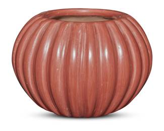 106
Angela Baca (1927-2014, Santa Clara Pueblo)
A redware pottery melon jar, mid/late 20th century
Incised to underside: Angela Baca
With lobed body and burnished red slip glaze
4" H x 5.625" Dia.
Estimate: $200 - $400