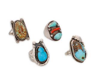264
A group of Southwest sterling silver and set stone rings
Mid/late 20th century
One stamped: Sterling
Four works comprising two rings with set turquoise, one a horseshoe-shaped ring with stamped accents, as well as a chunky ring with set turquoise and branch coral, and a large rectangular ring with a central set oval turquoise cabochon with brown matrix and silver wire accents
4 pieces
Ring sizes: 12.75 to 8.5
80.5 grams gross
Estimate: $300 - $500