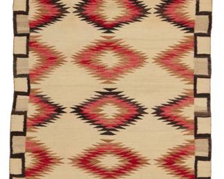 15
A Navajo regional rug
Early 20th century, Diné
Woven in cream, natural grey, black, red, tan, and dark brown wool with stacked serrated diamonds and a crenellated border
65.5" H x 35" W
Estimate: $500 - $700