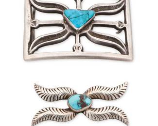 89
Two Southwest sterling silver and turquoise jewelry items
Two works:

Carl Allen Begay (d. 2015, Diné)
Late 20th/early 21st century
Stamped: C / [rising sun cypher]
A Navajo cast silver feathered concho-style brooch with a central set turquoise cabochon
1.25" H x 2.75" W

A Southwest sandcast sterling silver rectangular buckle
Mid/late 20th century
Unmarked
A heavy openwork buckle with a central set turquoise stone and incised accents
2.5" H x 3.25" W

2 pieces total
111.3 grams gross
Estimate: $600 - $800