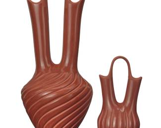 111
Pauline Romero (b. 1962, Jemez Pueblo)
Two redware wedding vases, late 20th/early 21st century
Each incised to underside: Pauline Romero / Jemez / NM
Comprising one incised with melon body, the other incised with a swirling pattern
2 pieces
Taller: 15.5" H x 6.75" W x 6.375" D; Shorter: 7.875" H x 3.5" W x 3.25" D
Estimate: $200 - $400