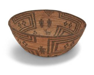 151
A large Apache figurative basket
Early 20th century; Southwest United States
A tall coiled tapered bowl with radiating meanders, floating crosses, and with male and female figures and small animal figures
5" H x 13.5" Dia.
Estimate: $1,000 - $1,500