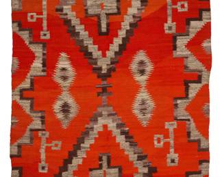 19
A Navajo Transitional blanket
Late 19th/early 20th century, Diné
Woven in red, natural grey, and natural grey wool, with stacked stepped diamonds, floating serrated diamonds, and stepped long borders
95" H x 57" W
Estimate: $1,000 - $1,500