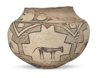 92
A large Zuni Pueblo polychrome pottery olla
Late 19th century
The three-color jar with red and brown bands of geometric motifs to shoulder above animals with heartlines within stepped cartouches, on a cream slip ground, with puki indentation to underside
9.5" H x 12.5" Dia., irregular
Estimate: $600 - $900