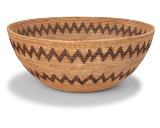 139
A large Yokuts basketry bowl
Early/mid-20th century; Central California
A coiled tapered basket with two zigzag bands
5.25" H x 13" Dia.
Estimate: $600 - $800
