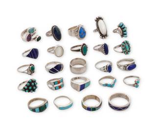 237
A group of Southwest-style silver and stone set rings
Mid/late 20th century
Nine variously marked for maker: KBM / TBA / [signpost pictograph] / DMD [conjoined, unknown] / LS / AL / MFC [conjoined, for Maryann and Felix Chavez, Zuni] / TK [stylized with double feather, for Ray Tracey (Navajo/Diné)/Knifewing Segura]; six marked for sterling
A group of rings featuring various stones including turquoise, coral, spiny oyster, lapis lazuli, sodalite, mother of pearl, amethyst, and malachite, in various styles including bezel-set, cluster-set, mosaic inlay, and silver overlay
24 pieces
Ring sizes: 10 to 4.75
91.9 grams gross
Estimate: $200 - $400