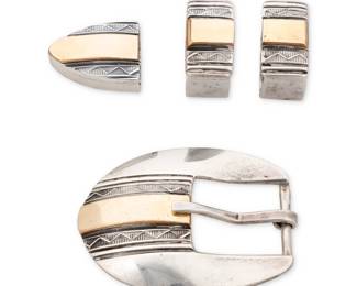 275
A Jeremy Delgarito Navajo sterling silver and 10K gold Ranger set
Jeremy C. Delgarito (b. 20th century, Diné)
Late 20th century
Stamped to belt tip: J.C. Delgarito / Sterling
Comprised of an oval sterling silver buckle, two keepers and a tip, each with a central band of 10K gold and stamped banding either side
4 pieces
Buckle: 1.75" H x 2.25" W, opening: 0.75"; each keeper: 1" H; tip: 0.75" H
63.6 grams gross
Estimate: $200 - $400